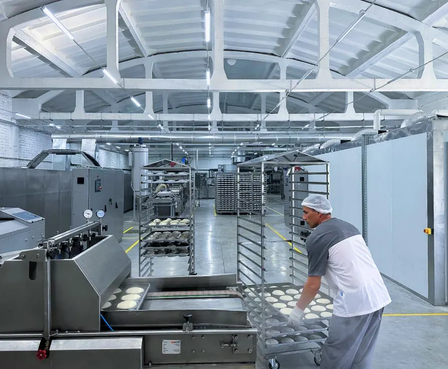 A worker at the HLIBO bun plant